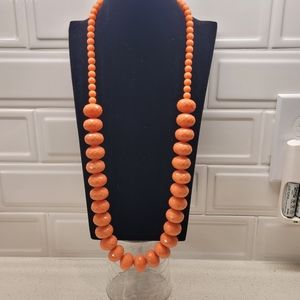 Long necklace with salmon colored beads
